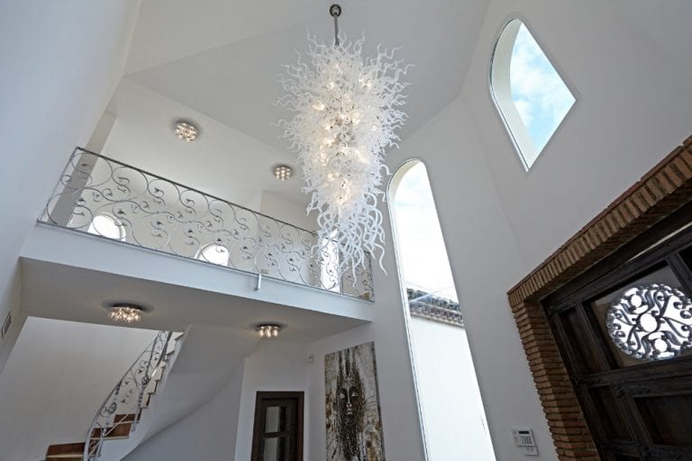 wiry ball looking chandelier in white