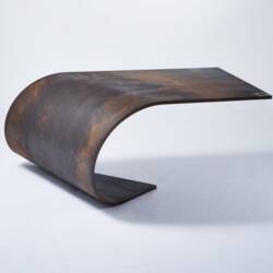 A Balanced Sheet of Steel: The Poised Table